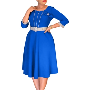 Detail of elegant bright blue round neck dress with bow shoulders and buckled belt