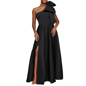 Detail of elegant black one-shoulder dress featuring a large bow and sexy high slit