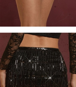 Detail of black sequined fringe skirt with delicate lace top for evening cocktail party