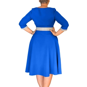Back view of elegant royal blue A-line dress with plaid detail on cuffs and waist