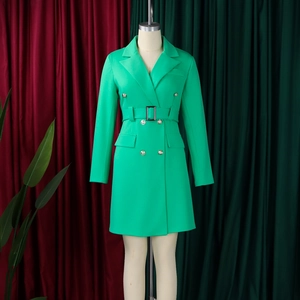 Detail of fruit green double-breasted blazer dress with matching belt and metal buttons