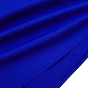 Macro shot of royal blue fabric texture and fine hem stitching on the A-line dress