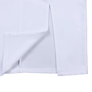Close-up of side slit detail on white V-neck dress showing neat hemline stitching