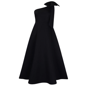Detailed view of the large exaggerated bow on the shoulder of this black evening gown