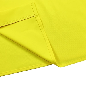 Detailed view of high-quality stitching and bright yellow fabric texture on a women's shirt