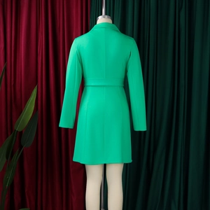 Rear view detail of slim fit bright green double-breasted blazer dress with belted waist