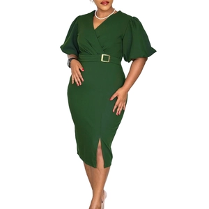 Detail of dark green V-neck dress featuring puff sleeves and a belted waist with metal buckle