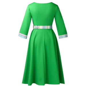 Detail view of the green A-line dress featuring a colorful plaid belt and matching cuffs