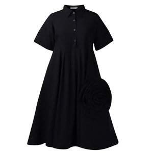 Detail of black A-line dress featuring a 3D rose flower and button-down shirt collar