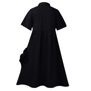 Detail view of the black short sleeve A-line dress back with high waist seam and side pocket