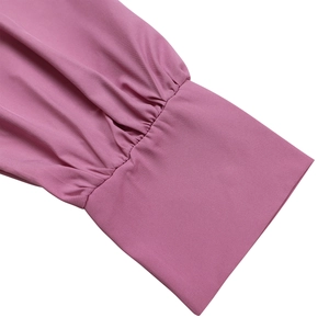 Detail of elegant pleated puff sleeve and straight cuff on solid color A-line dress