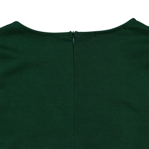Detail view of a dark green dress featuring a seamless invisible zipper on the back