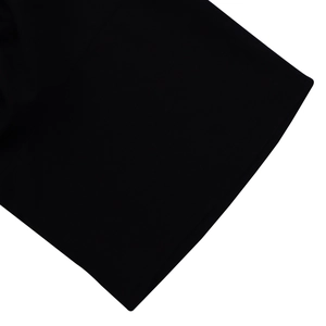 Macro detail of the high-quality black knitted fabric texture and fine stitching on the dress