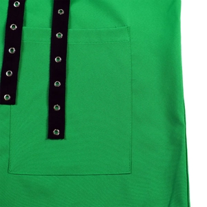 Detailed macro view of the bright green fabric texture with black straps and metal eyelets
