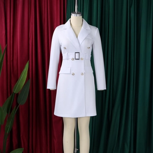 Detail of white double-breasted blazer dress with gold buttons and waist belt