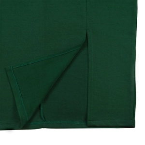 Close-up of precision stitching and slit detail on dark green ribbed knit dress