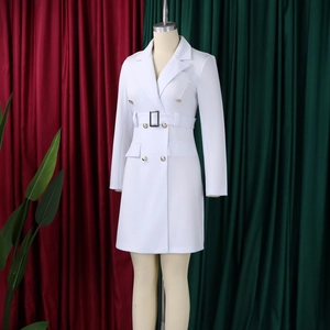 Detail of white double-breasted blazer dress with gold buttons and waist belt