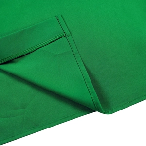 Detail shot of green fabric showing high-quality double-stitched edges and plain weave texture
