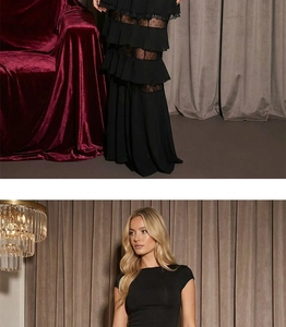 Detail of elegant black dress showing layered ruffles and dotted lace patchwork design