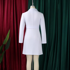 Rear view of white long-sleeved blazer dress featuring a waist belt and A-line silhouette