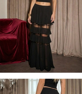 Detail of black tiered lace chiffon maxi skirt with polka dot sheer mesh panels