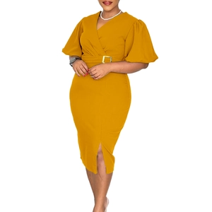 Detail of V-neck puff sleeve dress in ginger yellow with elegant gold buckle belt