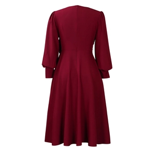 Detailed back view of a burgundy A-line dress featuring lantern sleeves and invisible zipper