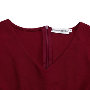 Detail view of the V-neckline and zipper closure on the dark red A-line dress