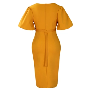 Rear view of ginger yellow midi dress with puff sleeves and cinched waist detailing