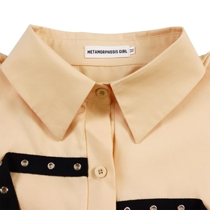 Detail of the shirt collar with brand label and black decorative eyelet strap