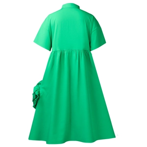 Detail of green A-line dress with high-waist pleats and elegant tiered ruffles on the side