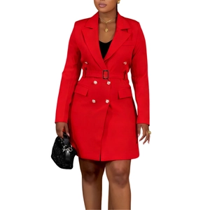 Detail of red double-breasted blazer dress featuring golden buttons and a waist belt