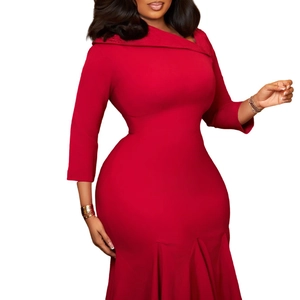 Detail of elegant red fishtail dress showing asymmetrical neckline and ruffled hem