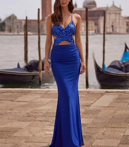 Detail of royal blue sequin evening gown showing the V-neck, waist cut-outs and ruched waist