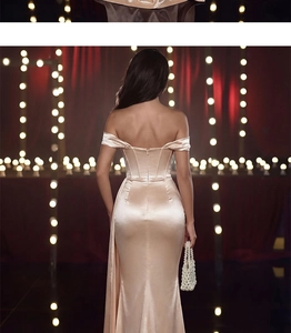 Detail of the champagne satin off-shoulder evening dress with an invisible back zipper