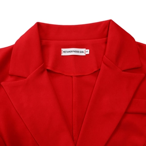 Detailed view of red dress neckline with brand label and size S stitching