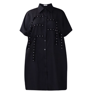 Detail of black short sleeve shirt dress with silver grommets and punk style ribbons