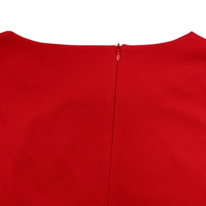 Detail view of the elegant red dress featuring a seamless concealed zipper and smooth fabric