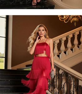 Detail of red fringe two-piece set with tiered tassel skirt for formal party events