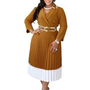 Detail of pleated dress featuring notched lapel and brown belt with golden buckle