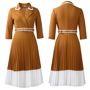 Detail of a brown and white pleated A-line dress with lapels and a matching thin belt