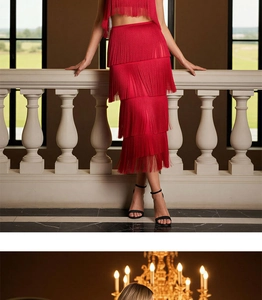 Detail shot of the vibrant red tiered fringe dress with layered tassels and crop top