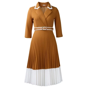 Close-up of contrast pleated A-line dress with white collar and decorative belt detail