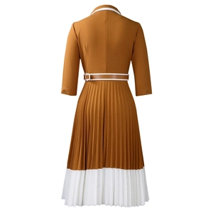 Detail of the pleated back design and caramel-white leather belt on the A-line dress