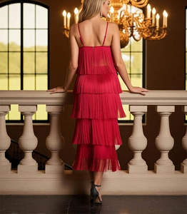 Detail of red tiered fringe dress featuring backless strap design and layered tassels