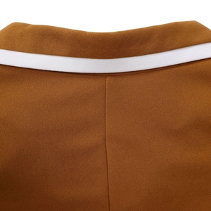 Close-up of brown dress back neckline with contrasting white decorative tape detail