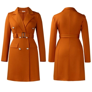 Detail of double-breasted long sleeve blazer dress with belt in dark orange color