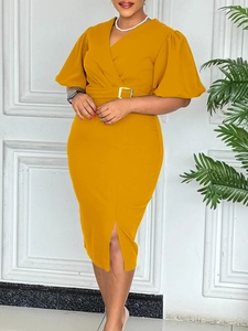 Elegant mustard yellow V-neck dress with puff sleeves, waist belt and center split