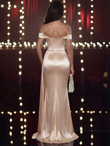 Elegant champagne satin off-shoulder fishtail evening gown with a sleek back view
