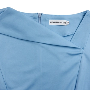 Close-up of the asymmetric neckline and seamless zipper on the light blue dress